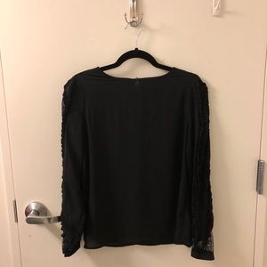 Long sleeved blouse with lace detailing on sleeves